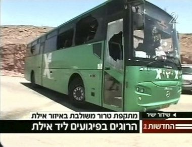 Damaged passenger bus under attack
