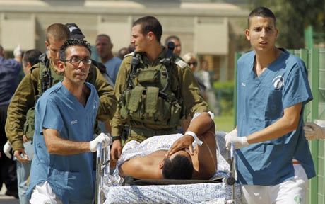 Israeli Medics evacuate person wounded Photo AP