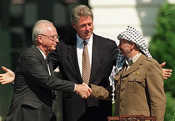 The two hands of September 1993, when Yitzhak Rabin and Yasir Arafat shook hands with President Clinton watching.