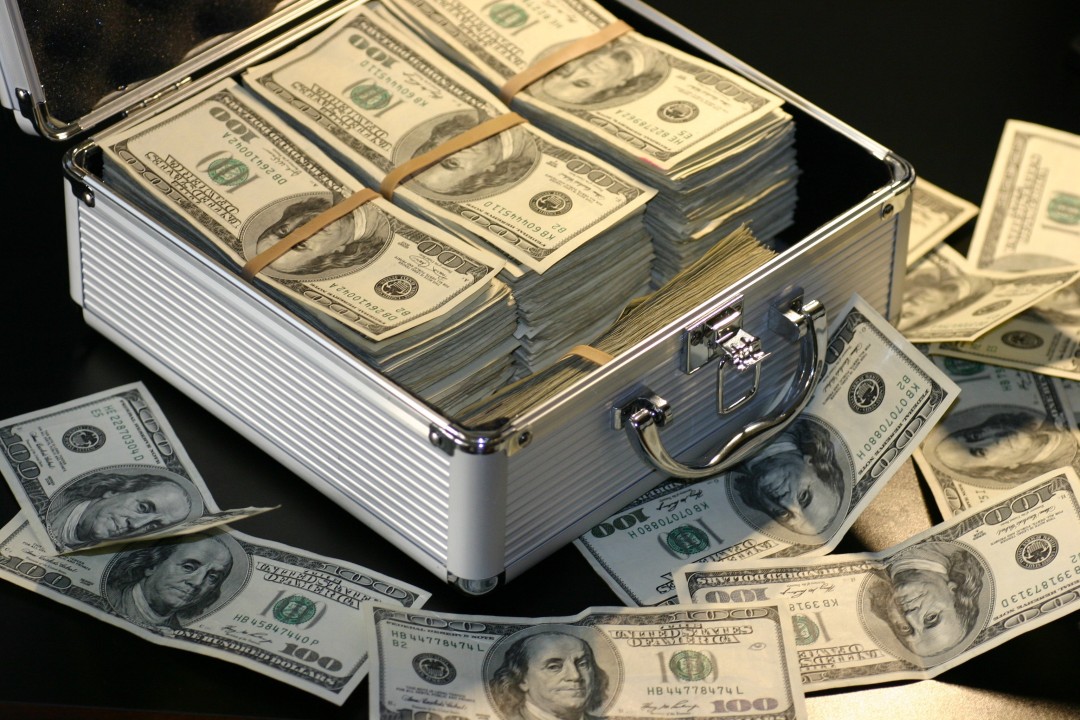 Photo by Pixabay: https://www.pexels.com/photo/grey-metal-case-of-hundred-dollar-bills-164652/