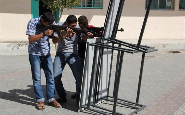 Teenagers participating in Hamas' youth terror programs